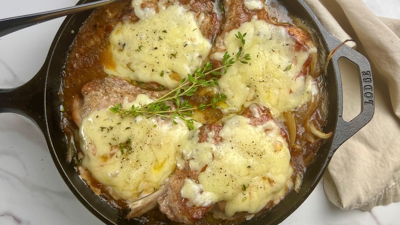 pork chops in skillet with cheese