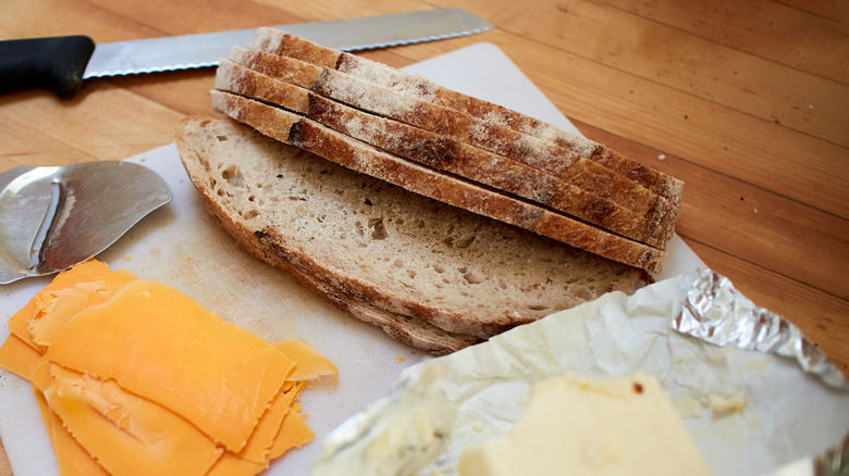 Sliced bread, butter, and cheese