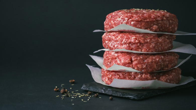 Stacked raw burger patties 