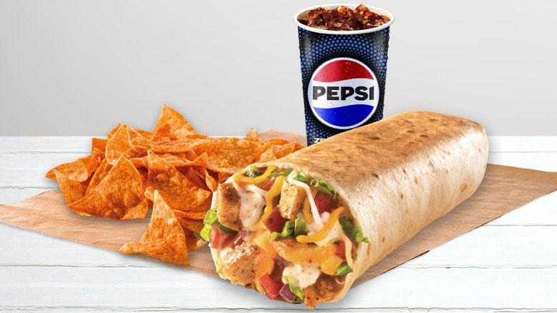 a Grilled Stuft Burrito with chips and a Pepsi