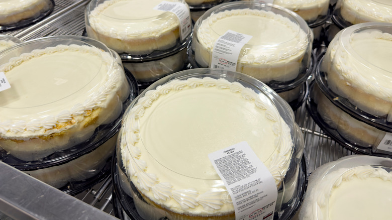 costco cheesecakes stacked in a cold fridge
