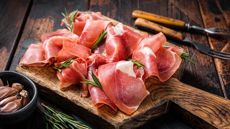 parma ham on wooden board