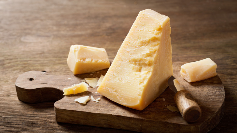 parmesan cheese on wooden block