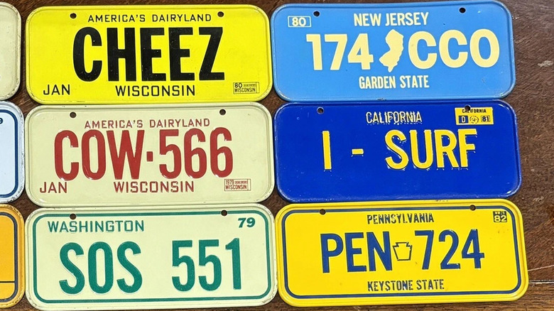 Collection of mini license plates from cereal boxes