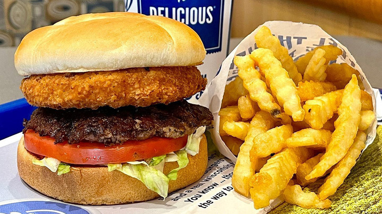 The Curderburger sandwich beside French fries on a table