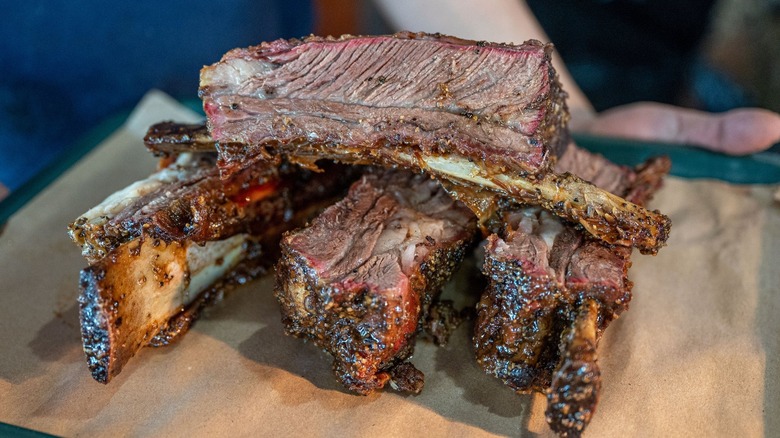 ribs piled on a serving tray at Hard Eight BBQ