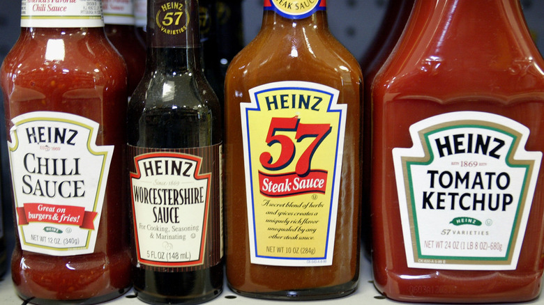 Heinz ketchup, Worcestershire sauce, steak sauce, and chili sauce on grocery store shelf
