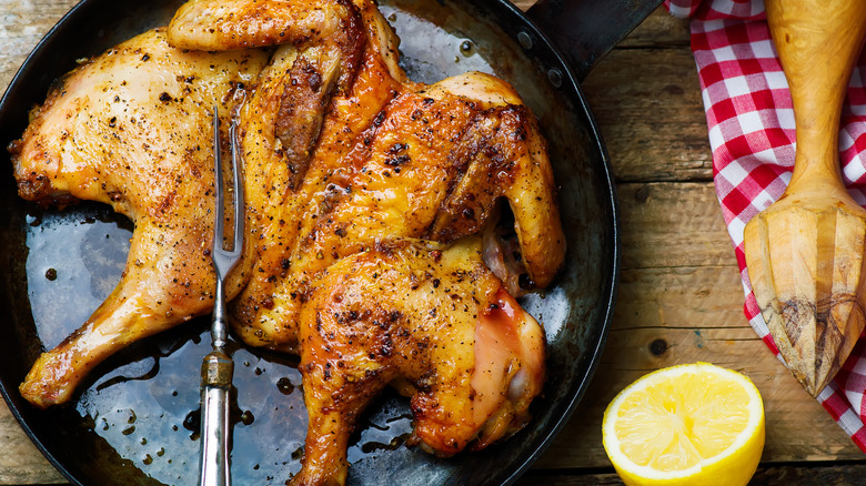 chicken under a brick