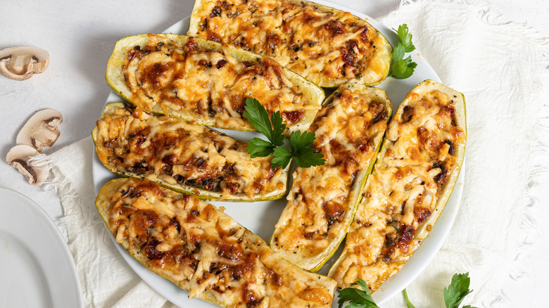 Cheesy Mushroom Zucchini Boats on a plate.