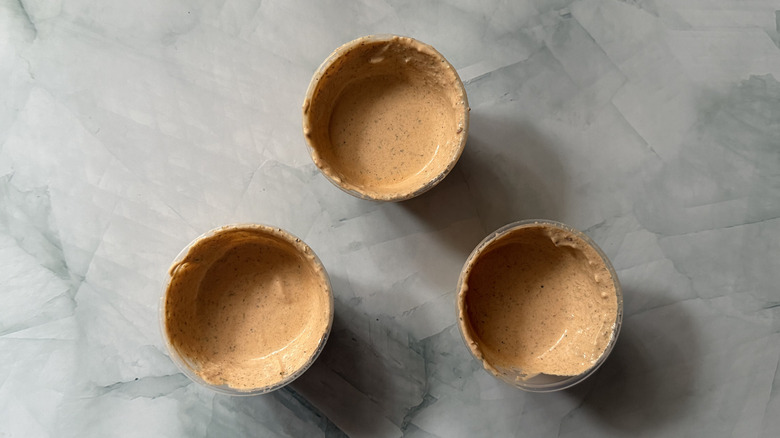 Three open cups of Adobo Ranch