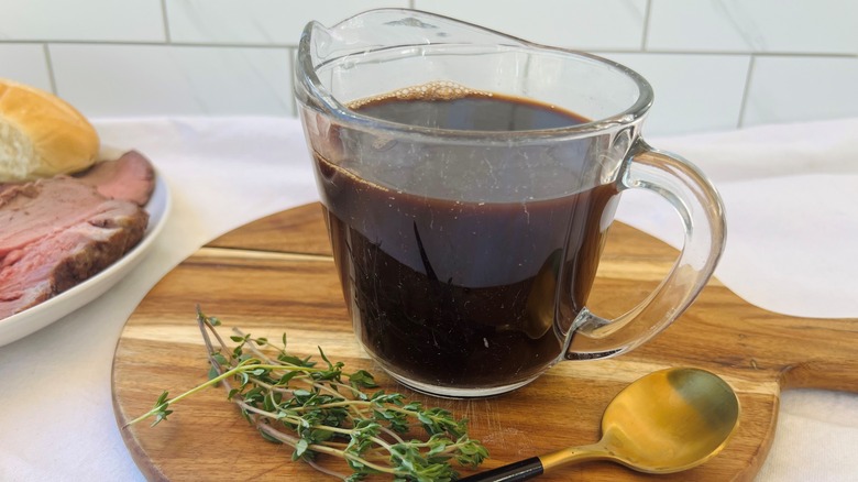 sliced beef with jus ramekin