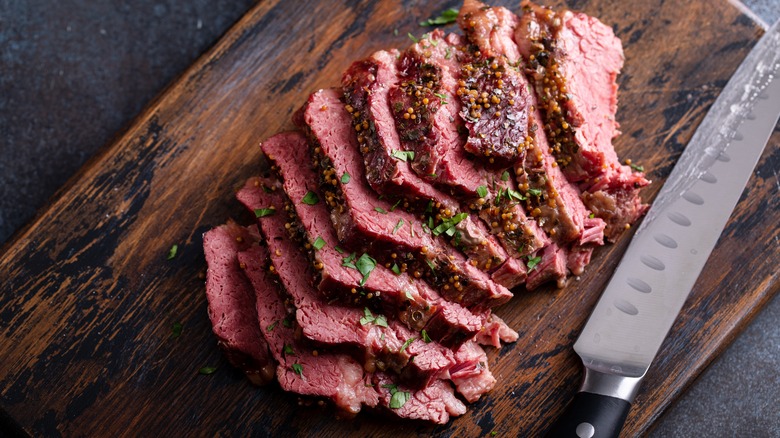 Sliced corned beef on a cutting board
