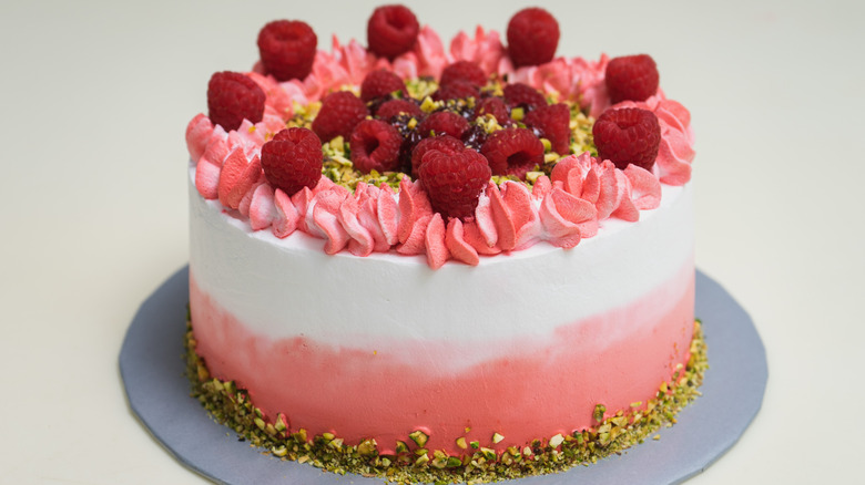 Cake with white to pink ombre frosting.