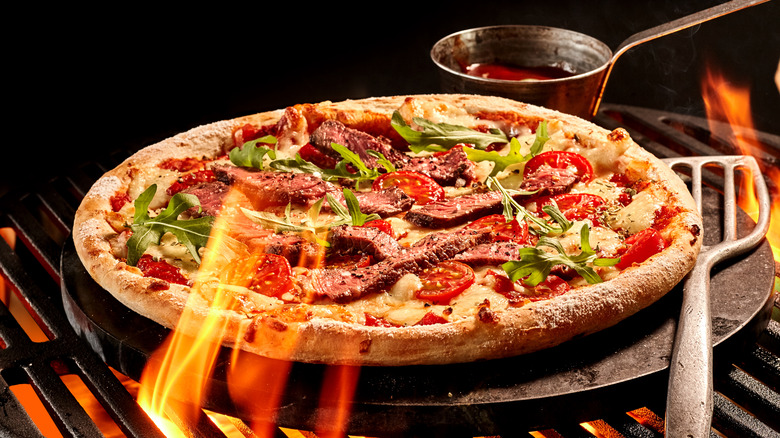 Cooking frozen pizza on grill