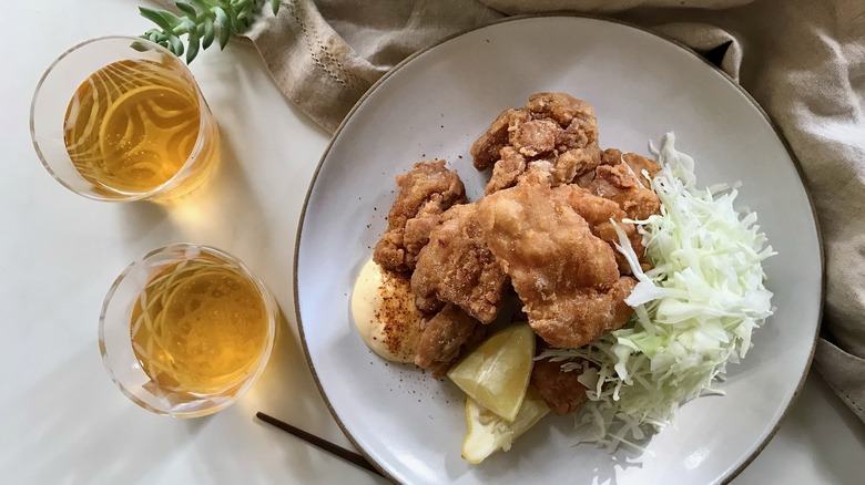 japanese fried chicken pieces on plate with beer