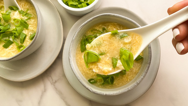 soup in bowl with white spoon