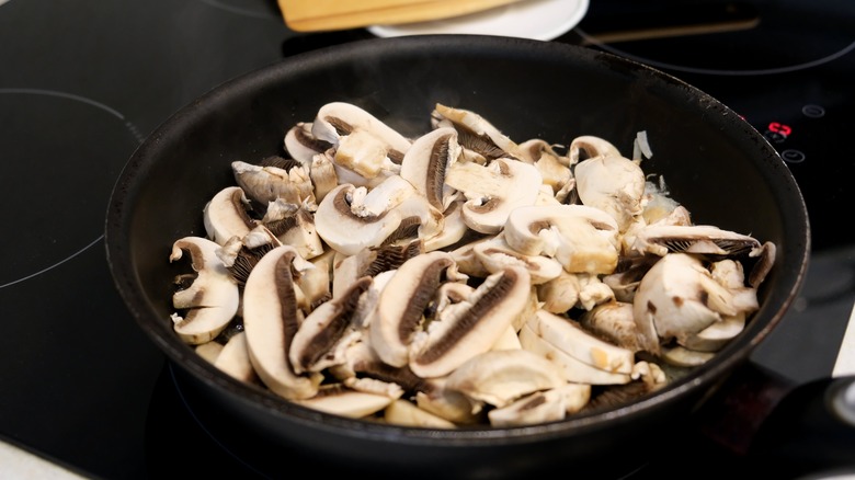 Skillet of mushrooms on a stove