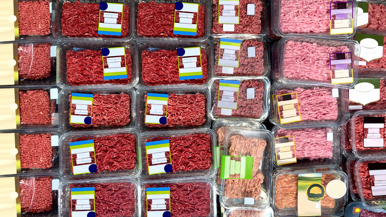Retail cooler filled with packages of ground meat