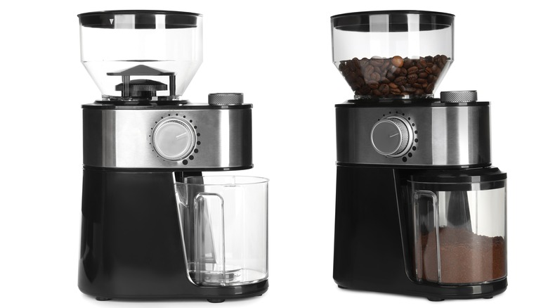 two coffee grinders, one with beans and one without