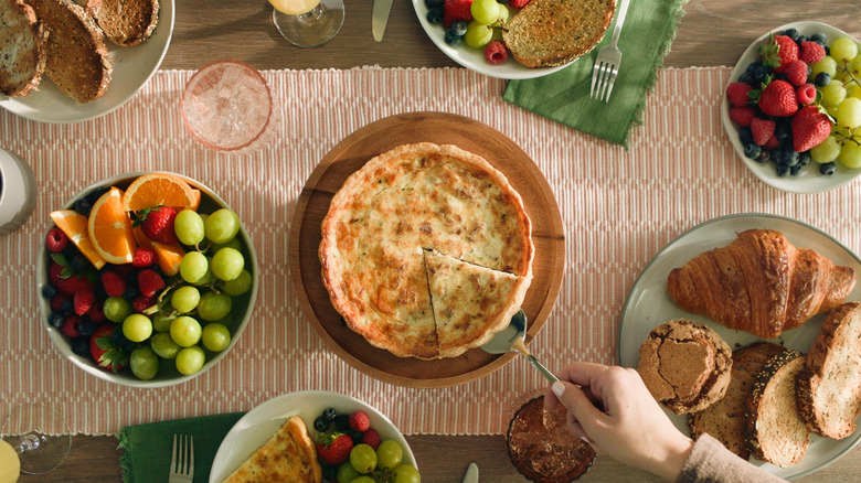 Brunch spread featuring La Terra Fina Quiche, pastries, and fruit