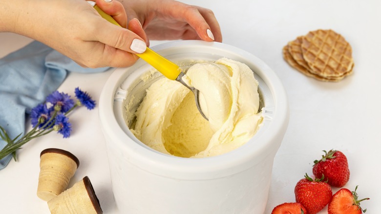 Scooping ice cream out of ice cream machine