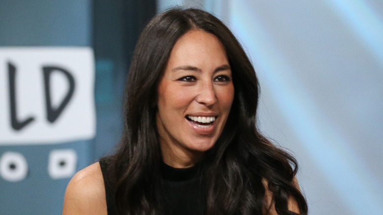 Joanna Gaines smiling on a talk show