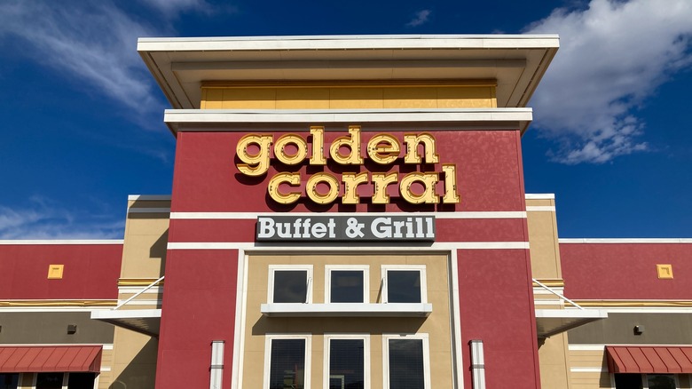 Exterior of a brightly colored Golden Corral on slightly cloudy day