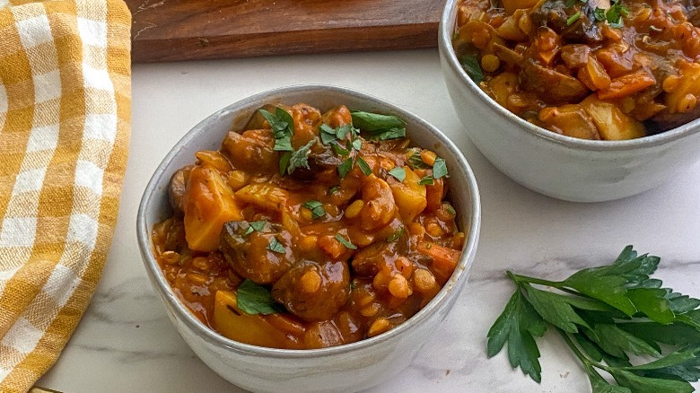 stew in small bowls with bread