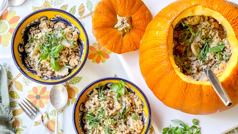 Stuffed pumpkin with aromatic rice on table