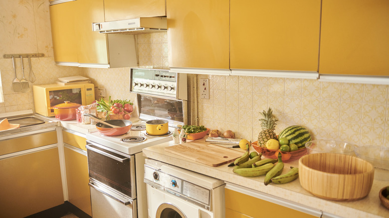 Yellow 1970s kitchen with fruit on counter