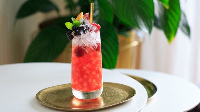 A sherry cobbler cocktail on a metal serving tray