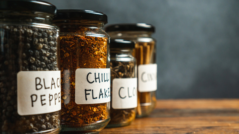 Close up of a row of labeled glass jars