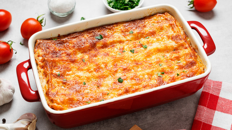 fresh lasagna in ceramic baking dish