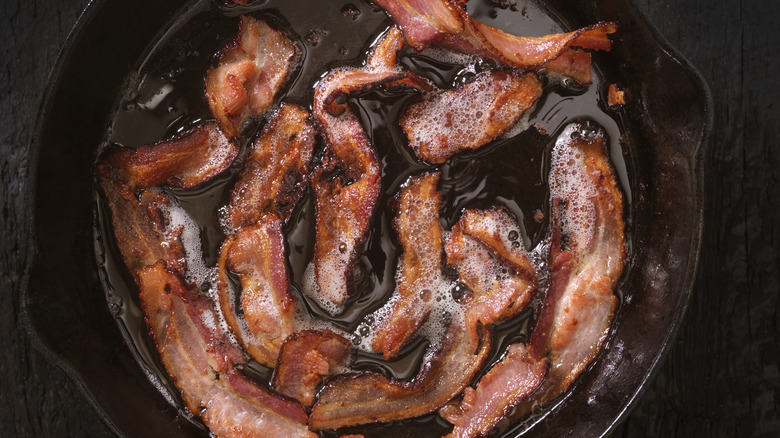 bacon sizzling in cast iron