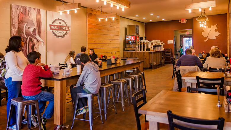 People sitting inside a Maple Street Biscuit Company restaurant