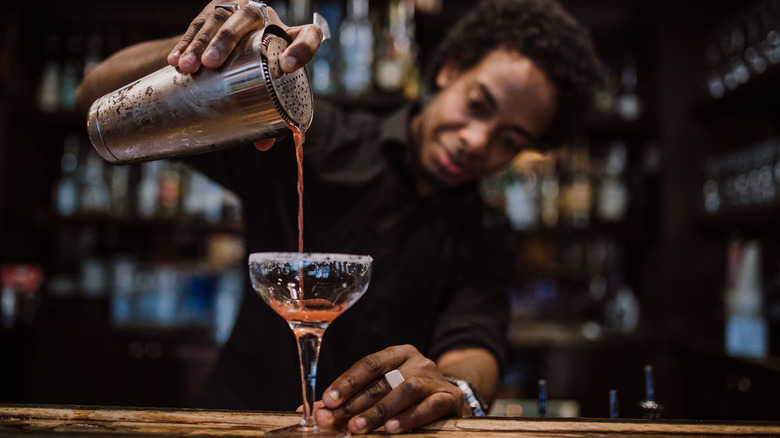 Bartender pouring cocktail