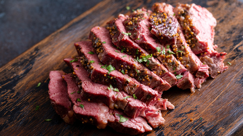 sliced corned beef on a cutting board