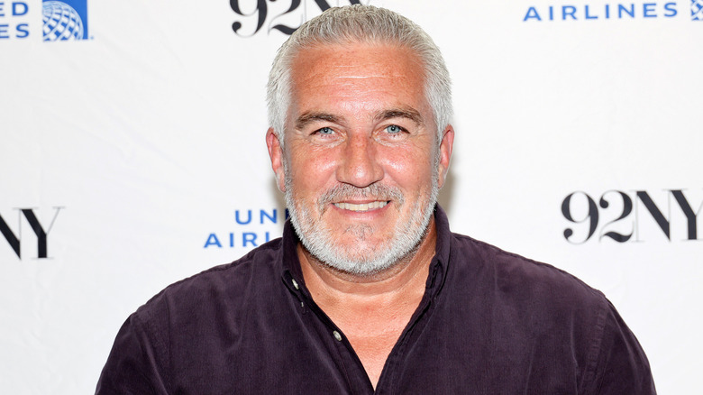 Paul Hollywood posed in front of 92NY and United Airlines step and repeat
