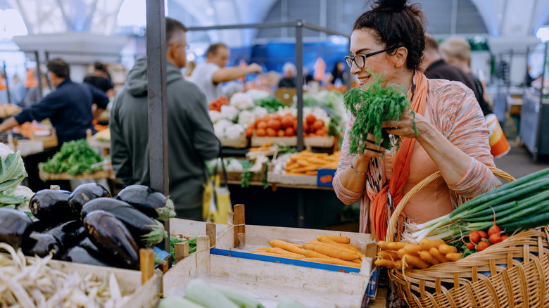smiling woman shopping at farmers market
