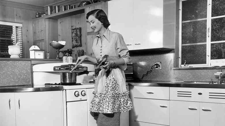 vintage photo of woman stirring pot