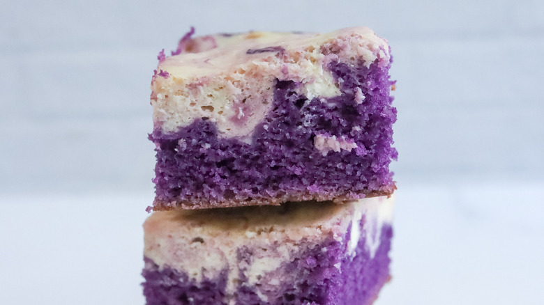 stack of ube cheesecake brownies