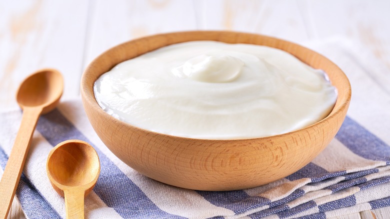 Greek yogurt in a wooden bowl