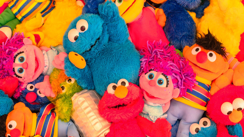 A pile of Sesame Street plush toys