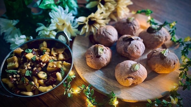 Ancient Roman Grape-Must Bread called Mustacei next to Alexandrian gourds